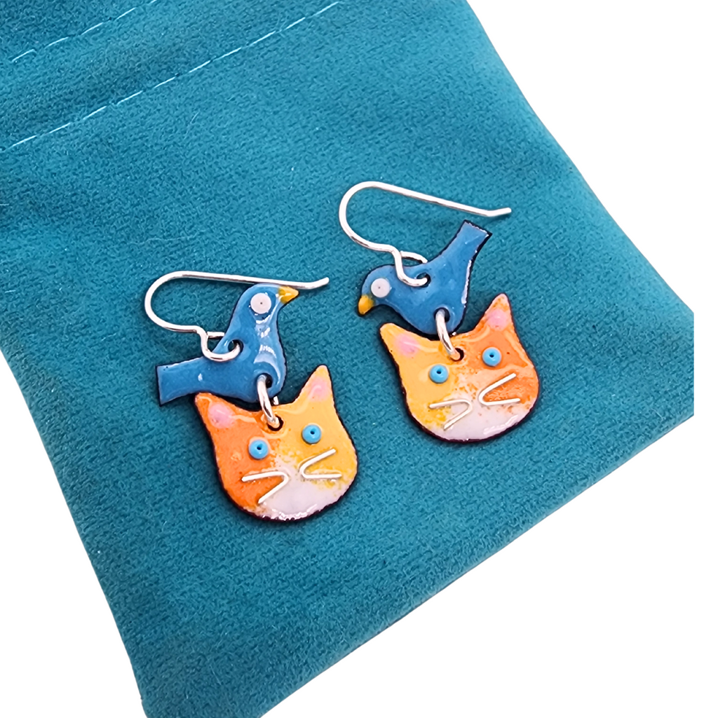 calico cats with a bluebird earrings
