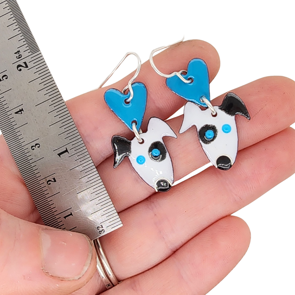 whimsical puppy love earrings next to a ruler