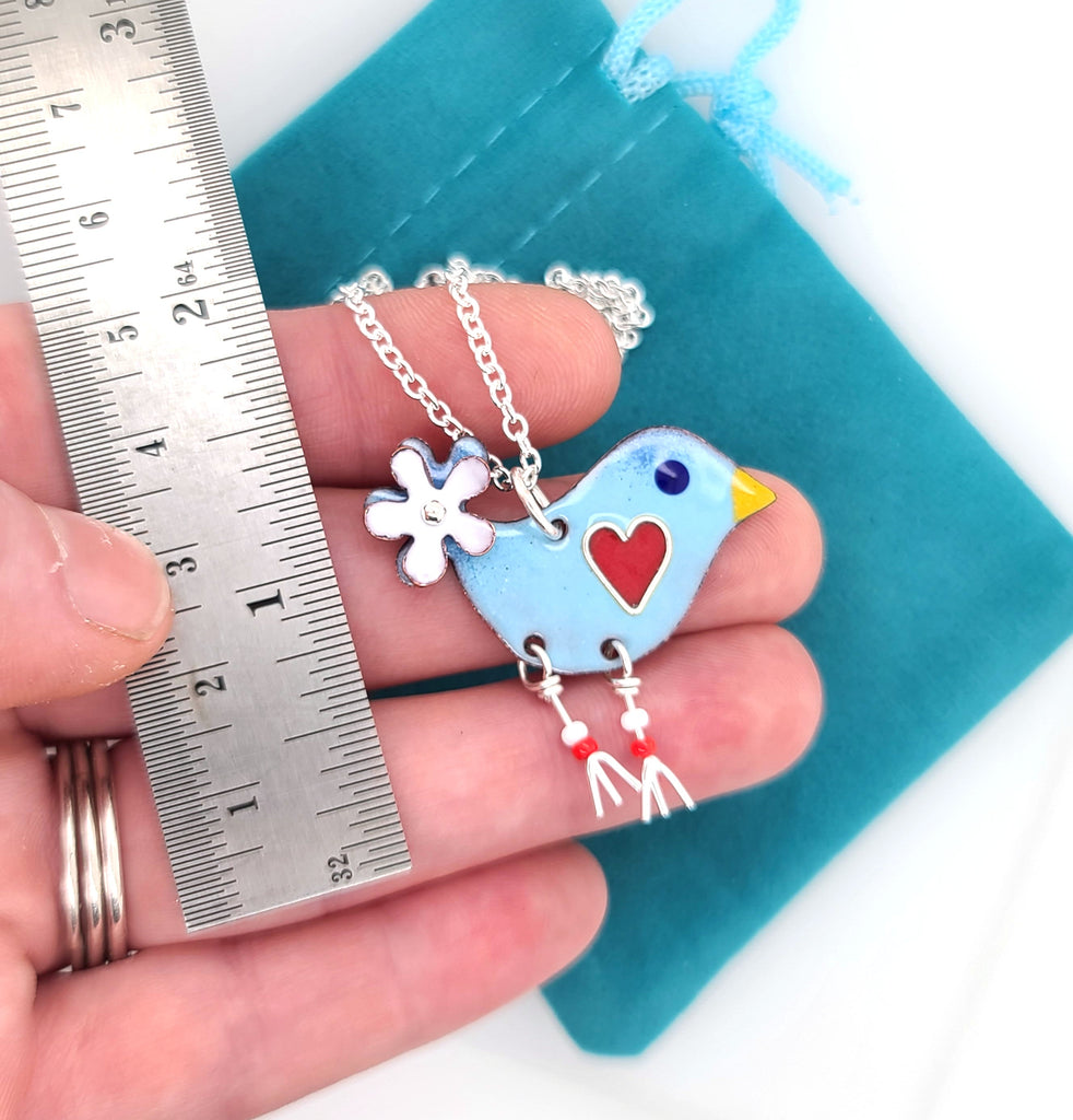 blue bird charm by ruler for scale