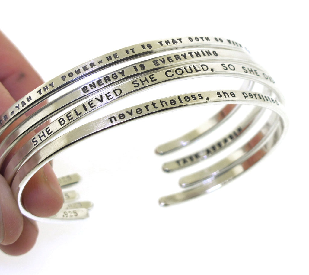 inspirational messages handstamped on custom silver cuff bracelets made by kathryn riechert jewelry