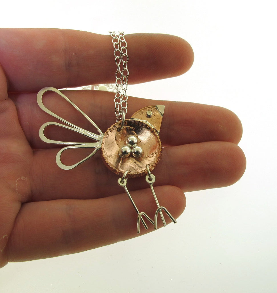 copper penny made into a bird necklace