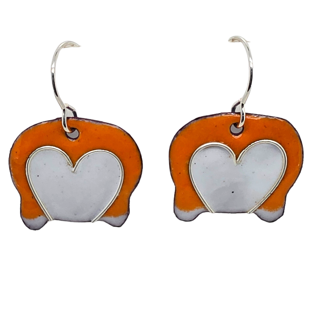 Playful corgi butt earrings with orange and white design on a white background