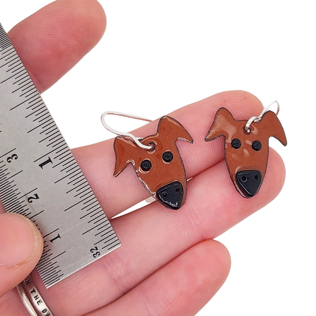 glass enamel earrings with a dog head design