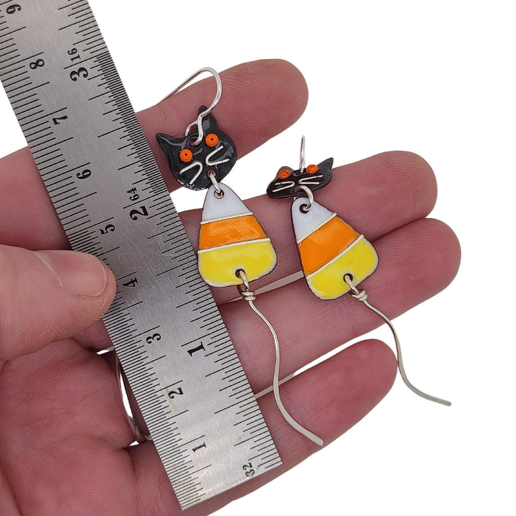 glass enamel dangle earrings featuring cats and candy corns