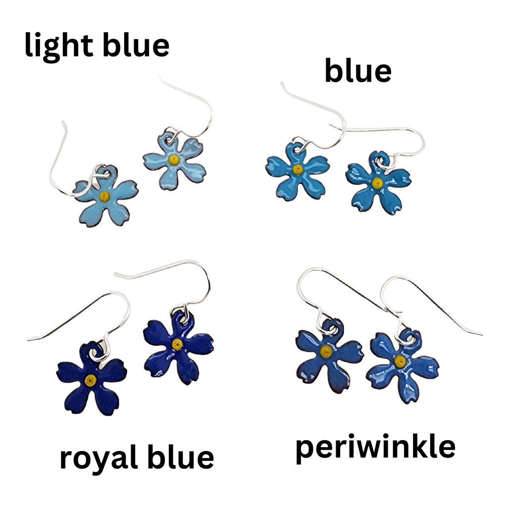 four different pairs of flower earrings in shades of blue