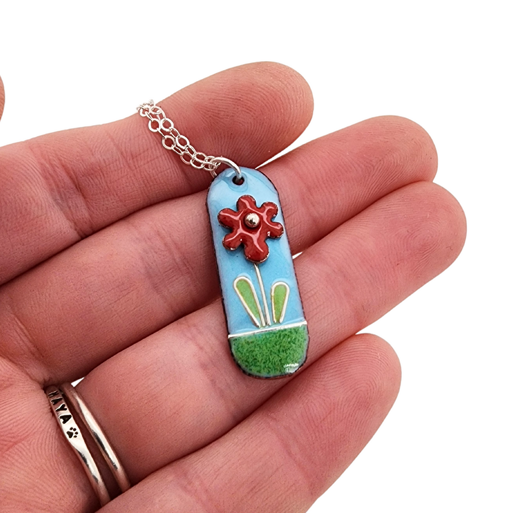 glass enamel pendant with red flower