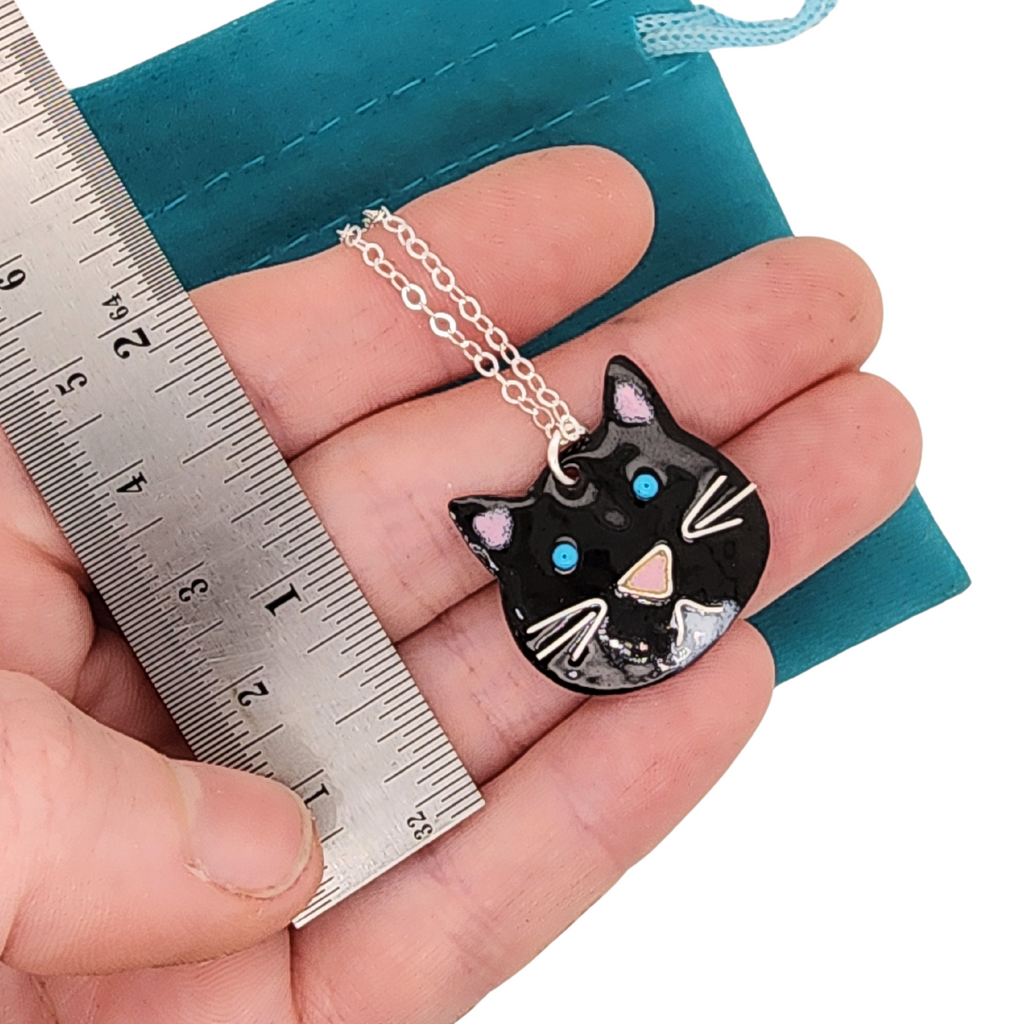 handmade charm necklace made of glass enamel in shape of a cat