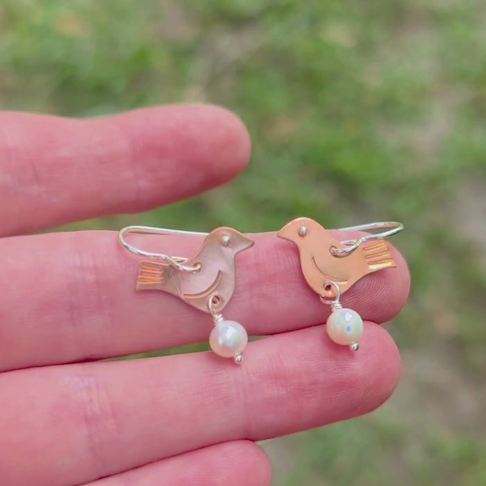 video of handmade copper bird earrings