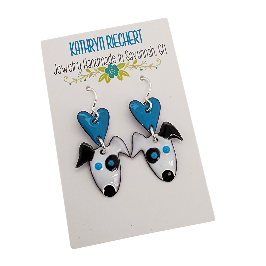 black and white dog earrings with a blue heart