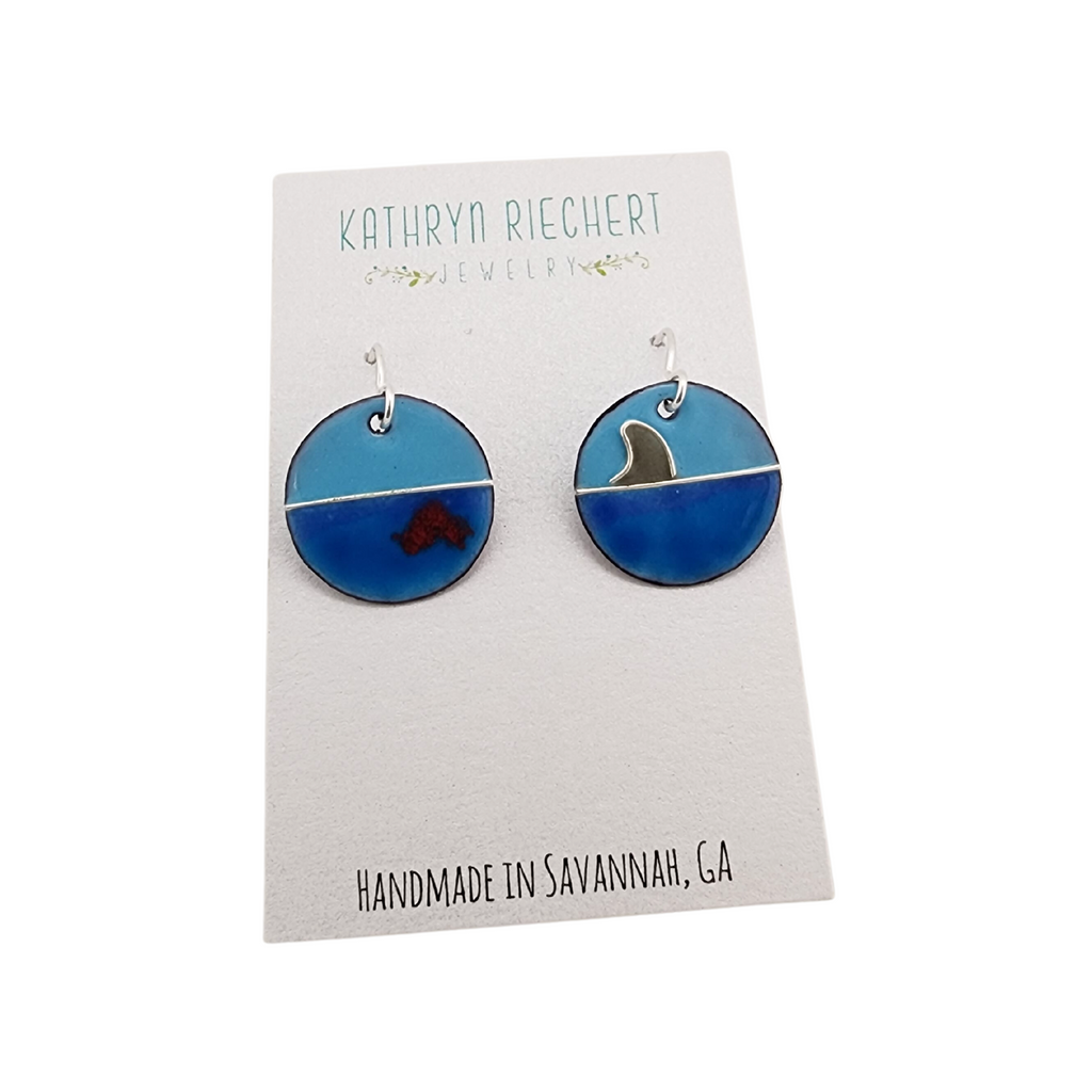 round earrings with a shark design