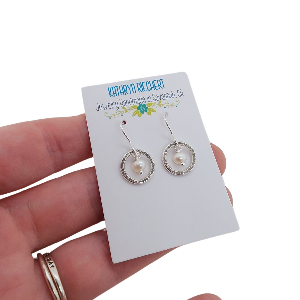 Kathryn Riechert's silver circle earrings on presentation card