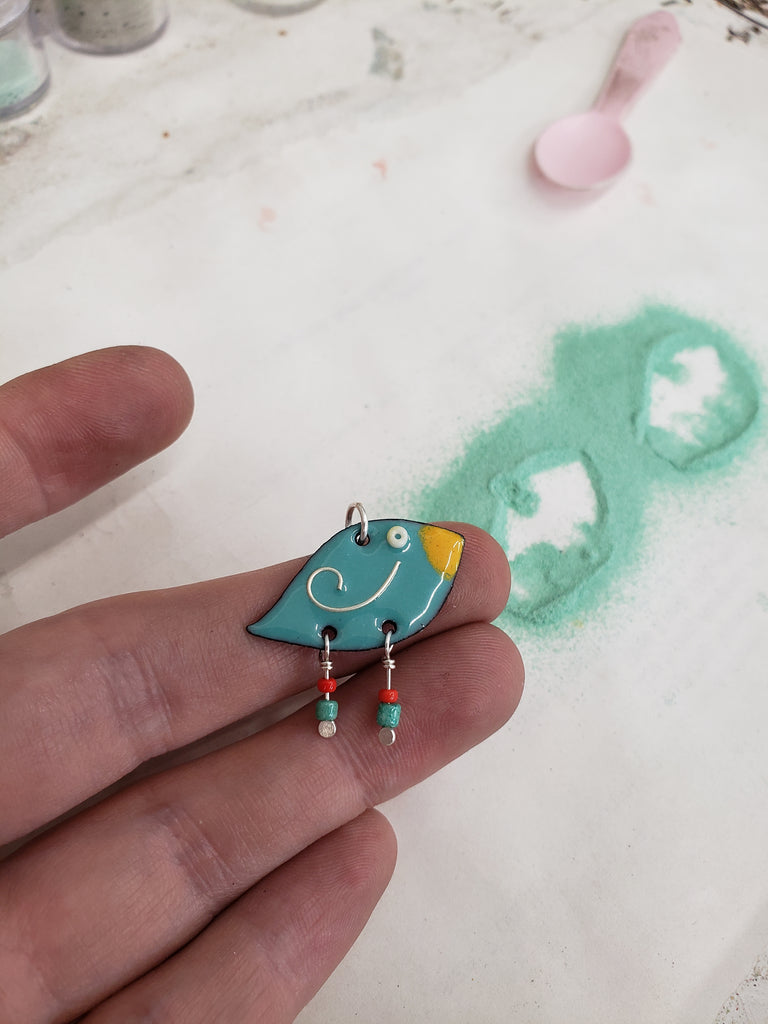 whimsical bird pendant by enameling powdered glass