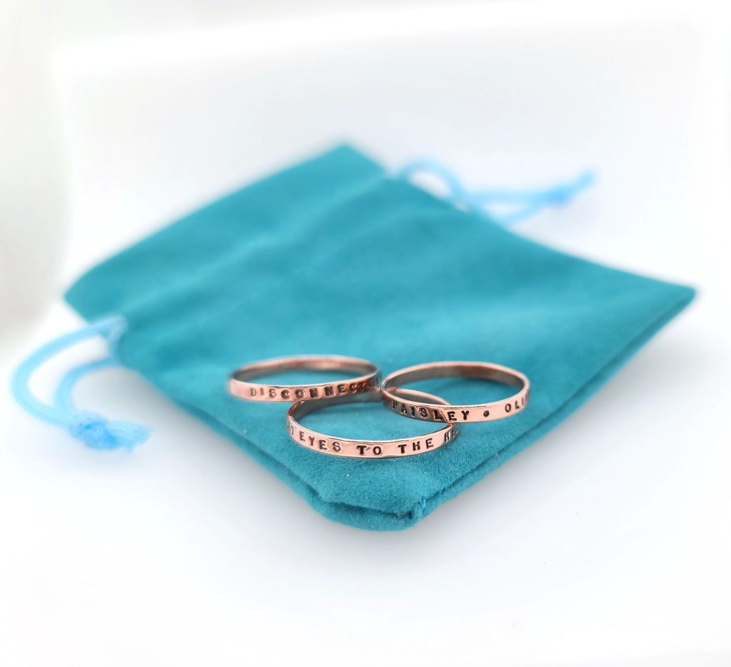 thin copper rings handstamped with messages