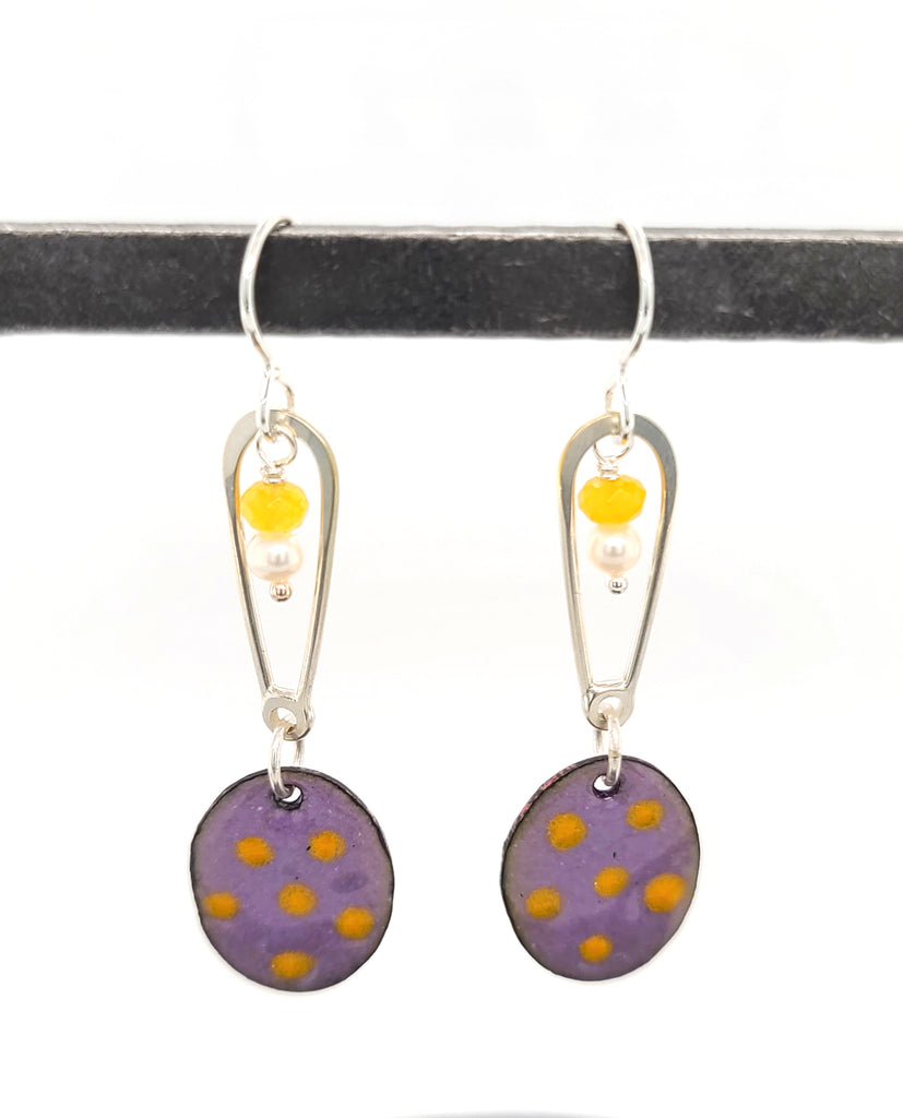 long enameled earrings with oval drops