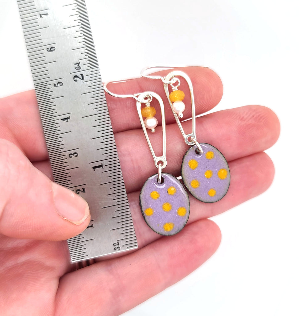 enameled earrings with purple and yellow colors