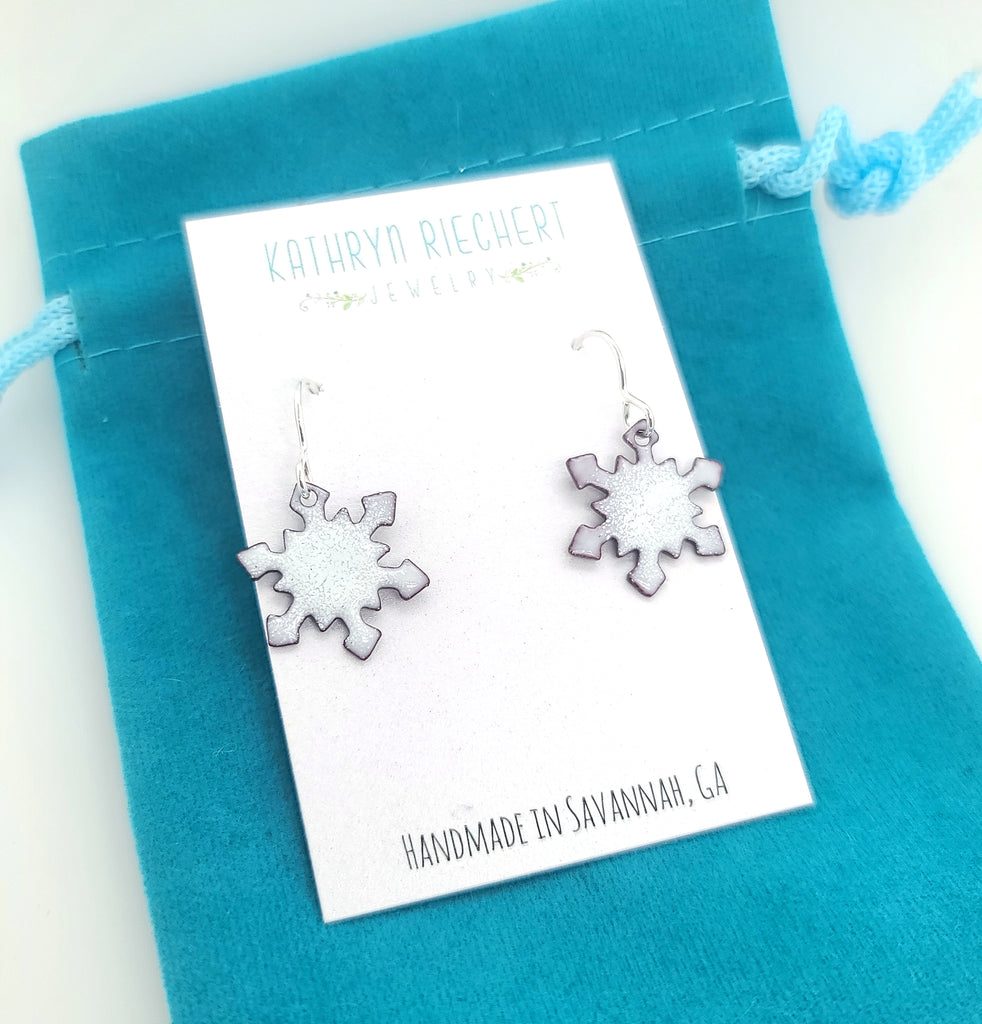 glass enamel earrings in the shape of a snowflake