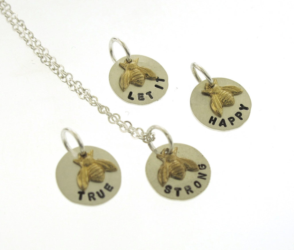 two tone silver and brass charm necklace
