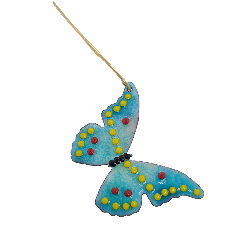 blue and yellow butterfly made of glass enamel and copper
